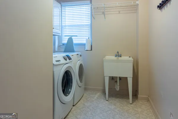 a utility room with dryer and washer