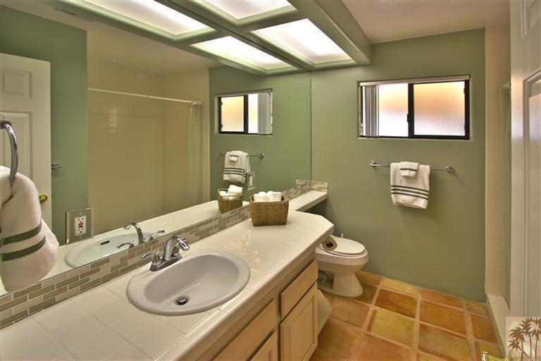 78491 Avenue 41 Bermuda Dunes, CA 92203 - Photo 13 of 16 a bathroom with a sink toilet and mirror