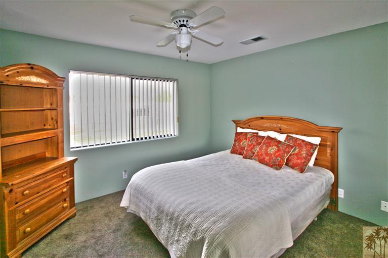 78491 Avenue 41 Bermuda Dunes, CA 92203 - Photo 14 of 16 a bedroom with a bed and window