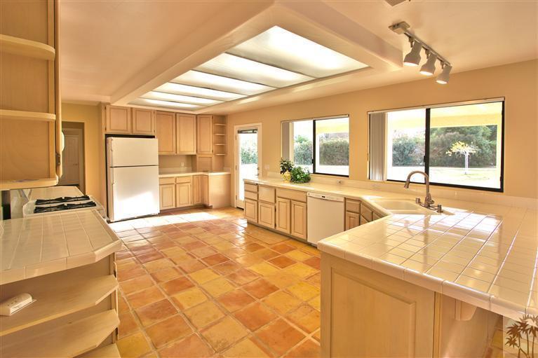 78491 Avenue 41 Bermuda Dunes, CA 92203 - Photo 5 of 16 a large kitchen with kitchen island stainless steel appliances a sink and counter space