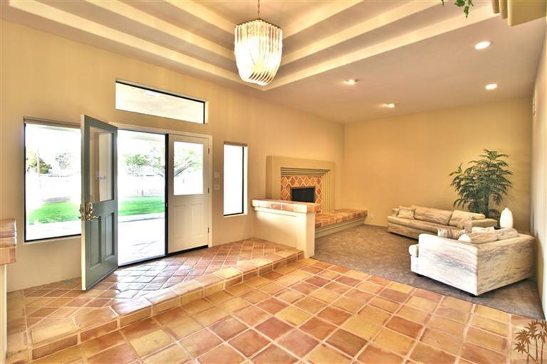 78491 Avenue 41 Bermuda Dunes, CA 92203 - Photo 6 of 16 a living room with furniture and a chandelier