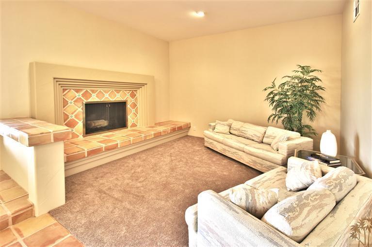 78491 Avenue 41 Bermuda Dunes, CA 92203 - Photo 8 of 16 a living room with furniture and a fireplace