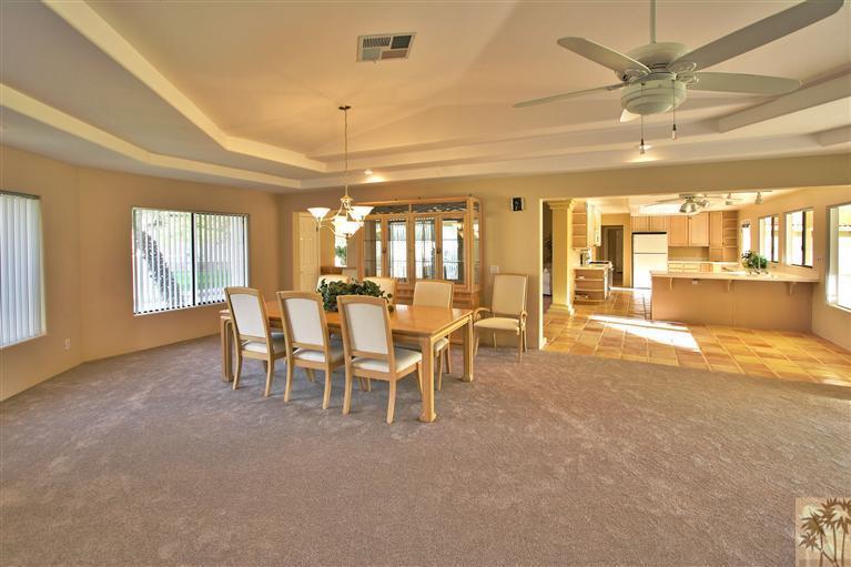 78491 Avenue 41 Bermuda Dunes, CA 92203 - Photo 9 of 16 a view of a dining room with furniture and a chandelier