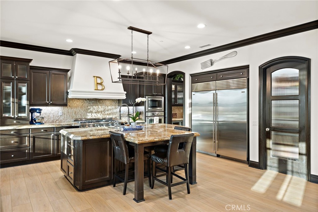 2 Galaxy Isle Ladera Ranch, CA 92694 - Photo 14 of 69 a kitchen with stainless steel appliances granite countertop a stove and refrigerator