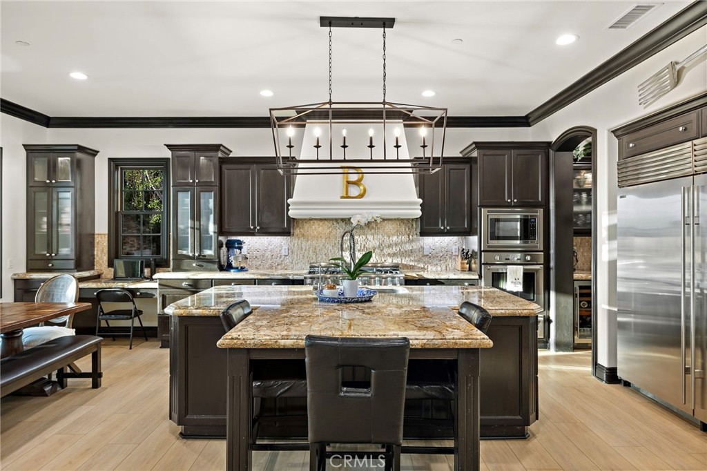 2 Galaxy Isle Ladera Ranch, CA 92694 - Photo 15 of 69 a kitchen with stainless steel appliances granite countertop a stove and refrigerator