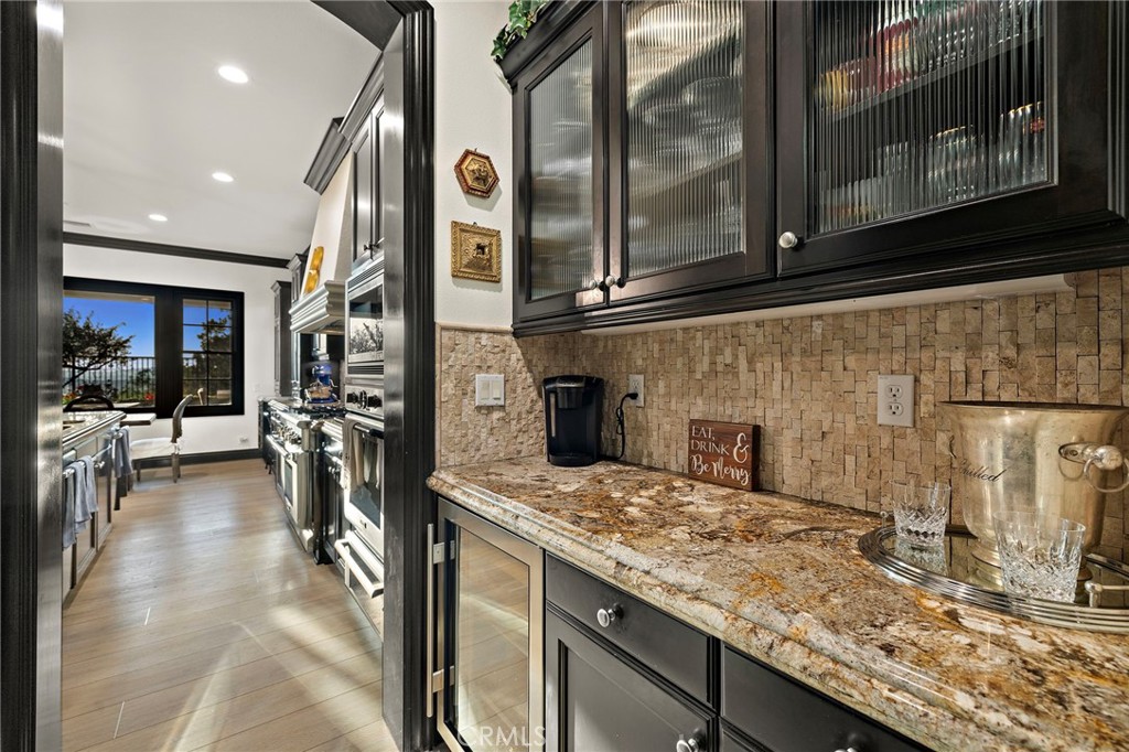 2 Galaxy Isle Ladera Ranch, CA 92694 - Photo 16 of 69 a view of a kitchen with stainless steel appliances granite countertop a sink and cabinets