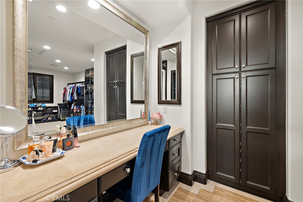 2 Galaxy Isle Ladera Ranch, CA 92694 - Photo 34 of 69 a room with table chairs and cabinets