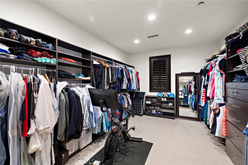 2 Galaxy Isle Ladera Ranch, CA 92694 - Photo 35 of 69 a view of walk in closet with clothes