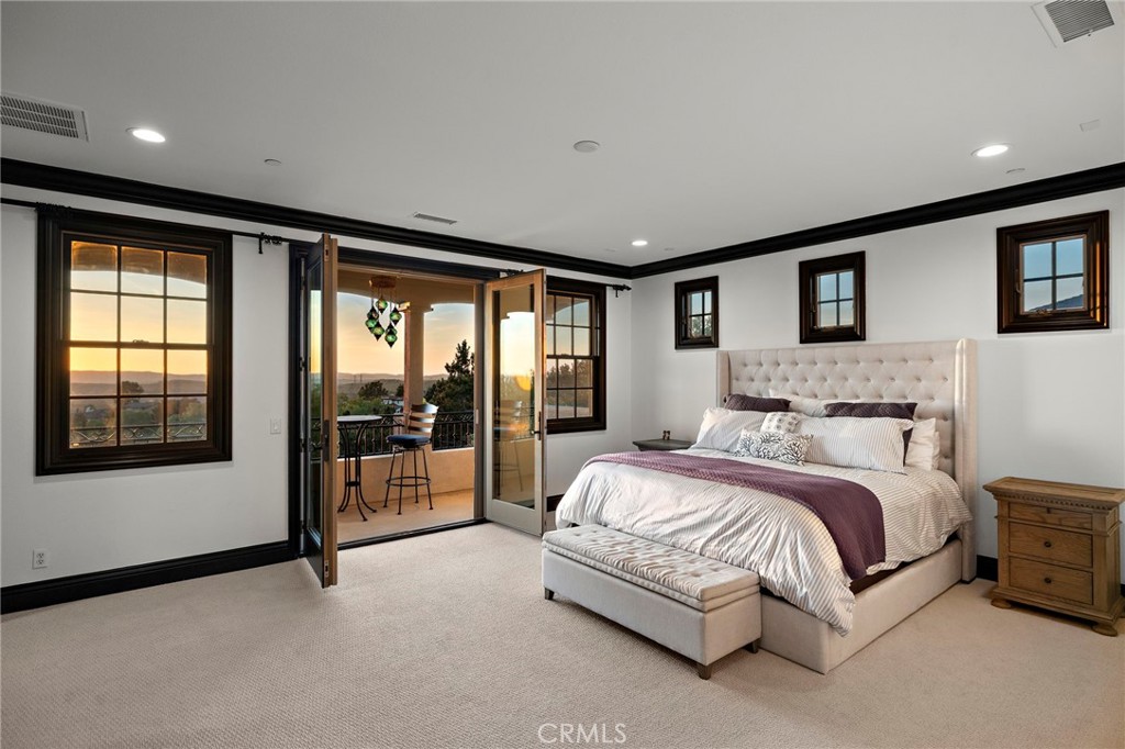 2 Galaxy Isle Ladera Ranch, CA 92694 - Photo 36 of 69 a spacious bedroom with a large bed and a large window