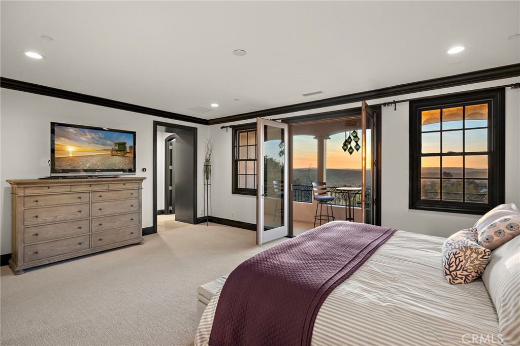 2 Galaxy Isle Ladera Ranch, CA 92694 - Photo 38 of 69 a bedroom with a bed and a flat tv screen