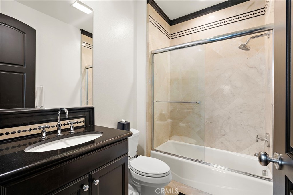 2 Galaxy Isle Ladera Ranch, CA 92694 - Photo 42 of 69 a bathroom with a granite countertop sink toilet and shower