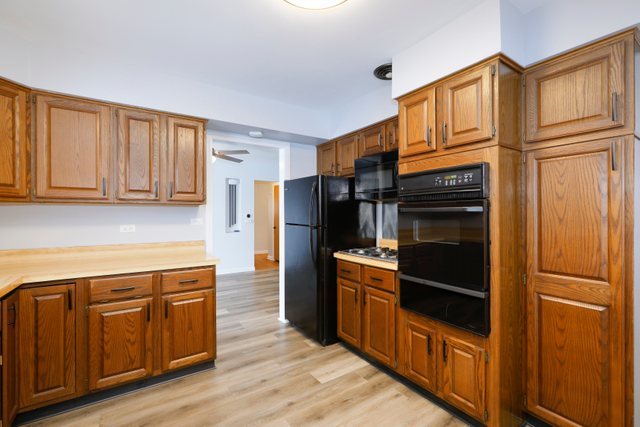 28W777 Garys Mill Road Winfield, IL 60190 - Photo 13 of 47 a kitchen with stainless steel appliances granite countertop a refrigerator and a stove top oven