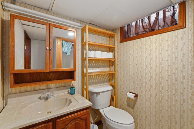 28W777 Garys Mill Road Winfield, IL 60190 - Photo 27 of 47 a bathroom with a sink a toilet and a mirror