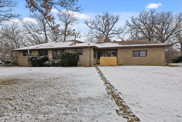 28W777 Garys Mill Road Winfield, IL 60190 - Photo 29 of 47 a front view of a house with a yard covered in snow
