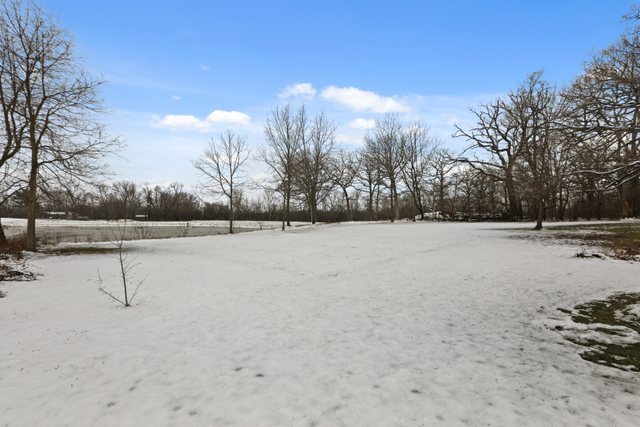 28W777 Garys Mill Road Winfield, IL 60190 - Photo 43 of 47 a view of a field with trees in the background
