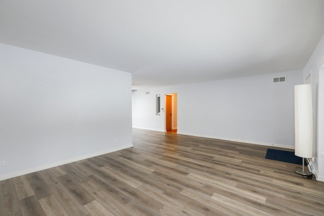 28W777 Garys Mill Road Winfield, IL 60190 - Photo 8 of 47 a view of an empty room and wooden floor