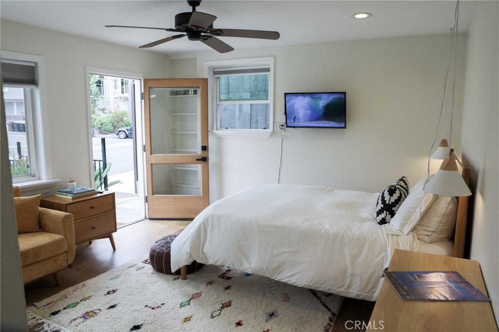 160 Avenida Florencia, Unit B San Clemente, CA 92672 - Photo 13 of 48 a bedroom with a bed and glass walk in closet