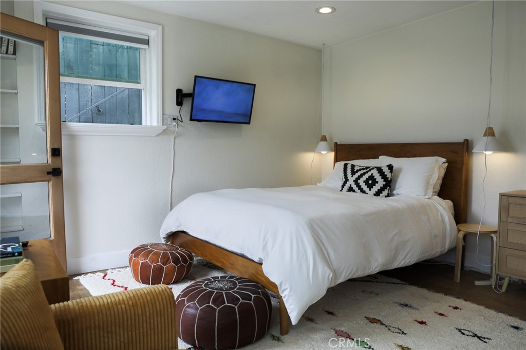 160 Avenida Florencia, Unit B San Clemente, CA 92672 - Photo 16 of 48 a bedroom with a bed and a television