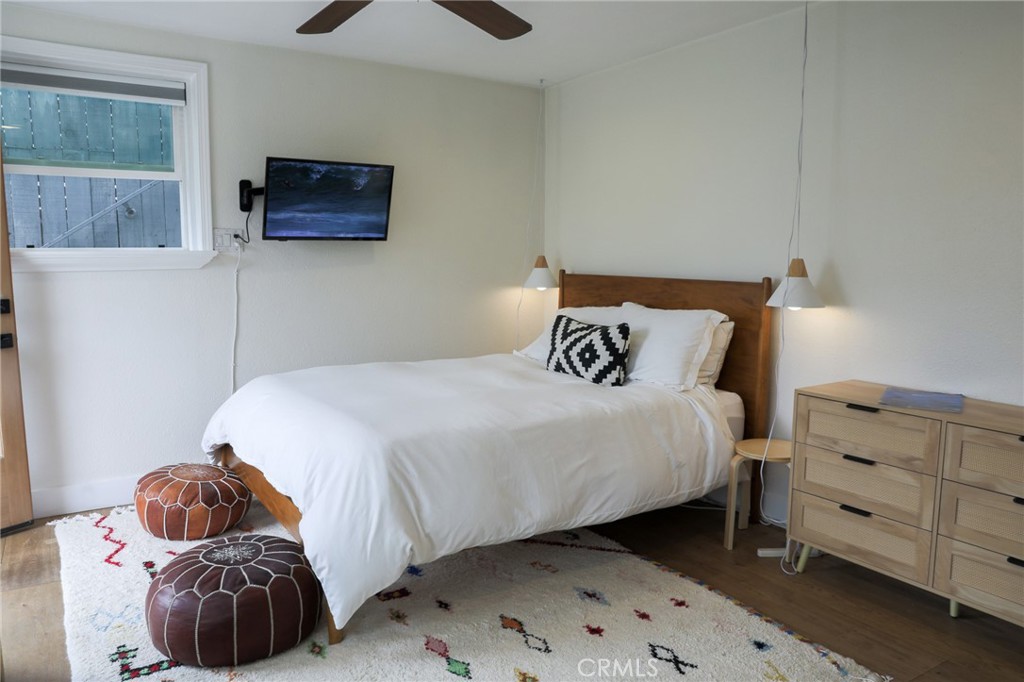 160 Avenida Florencia, Unit B San Clemente, CA 92672 - Photo 17 of 48 a bedroom with a bed and a window