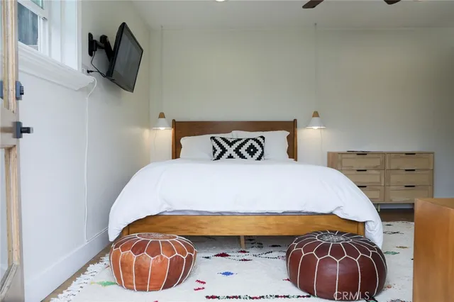 a living room with furniture and a walk in closet