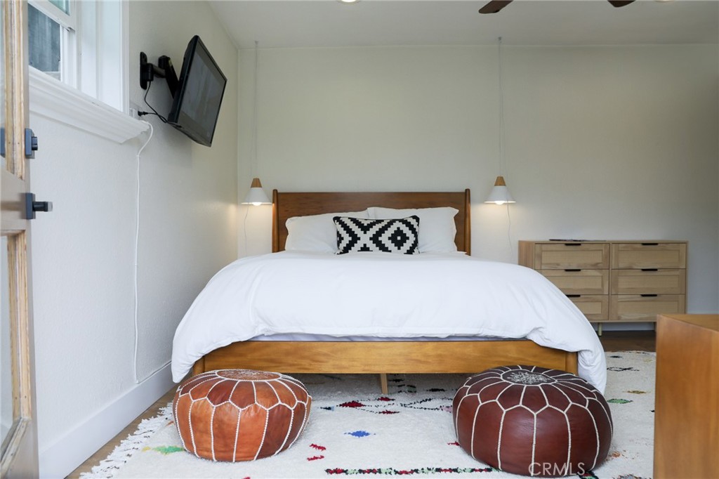 160 Avenida Florencia, Unit B San Clemente, CA 92672 - Photo 18 of 48 a bedroom with a bed and a television