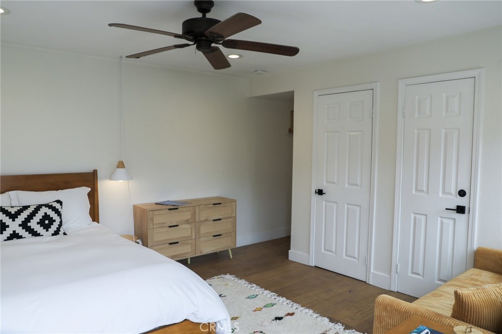 160 Avenida Florencia, Unit B San Clemente, CA 92672 - Photo 19 of 48 a bedroom with a bed and a ceiling fan