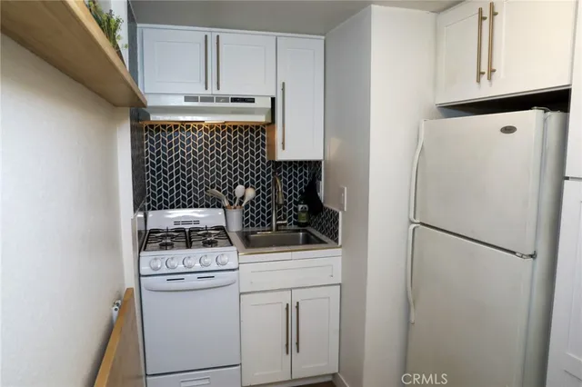 a kitchen with a stove and a microwave
