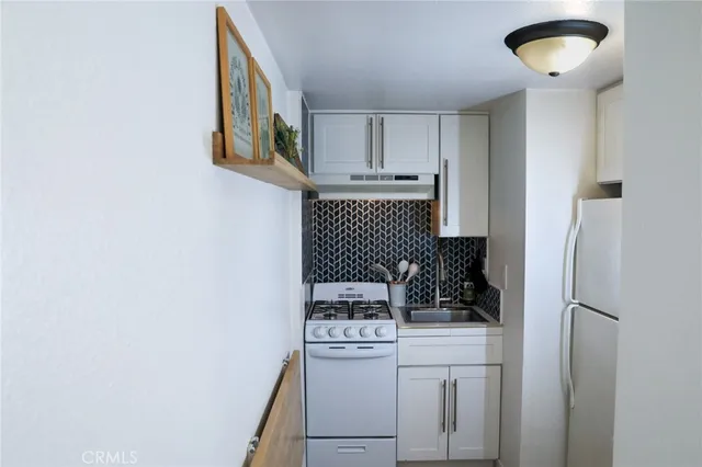a bathroom with a shower and a sink
