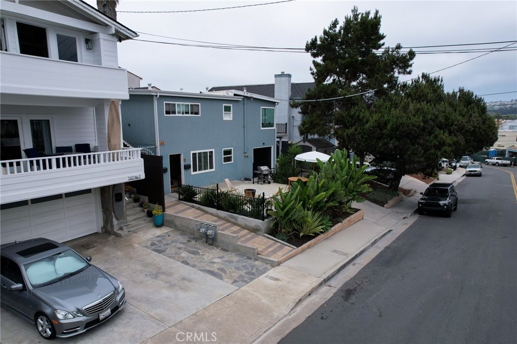 160 Avenida Florencia, Unit B San Clemente, CA 92672 - Photo 33 of 48 a view of a car park in front of house