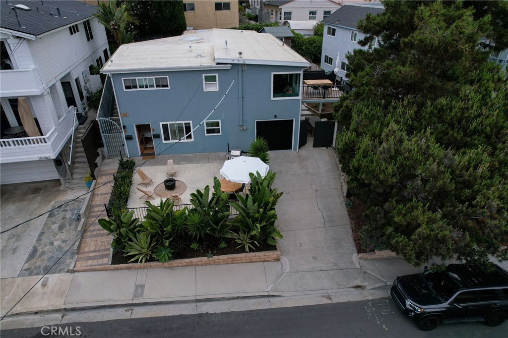 160 Avenida Florencia, Unit B San Clemente, CA 92672 - Photo 36 of 48 an aerial view of a house with a yard and garage