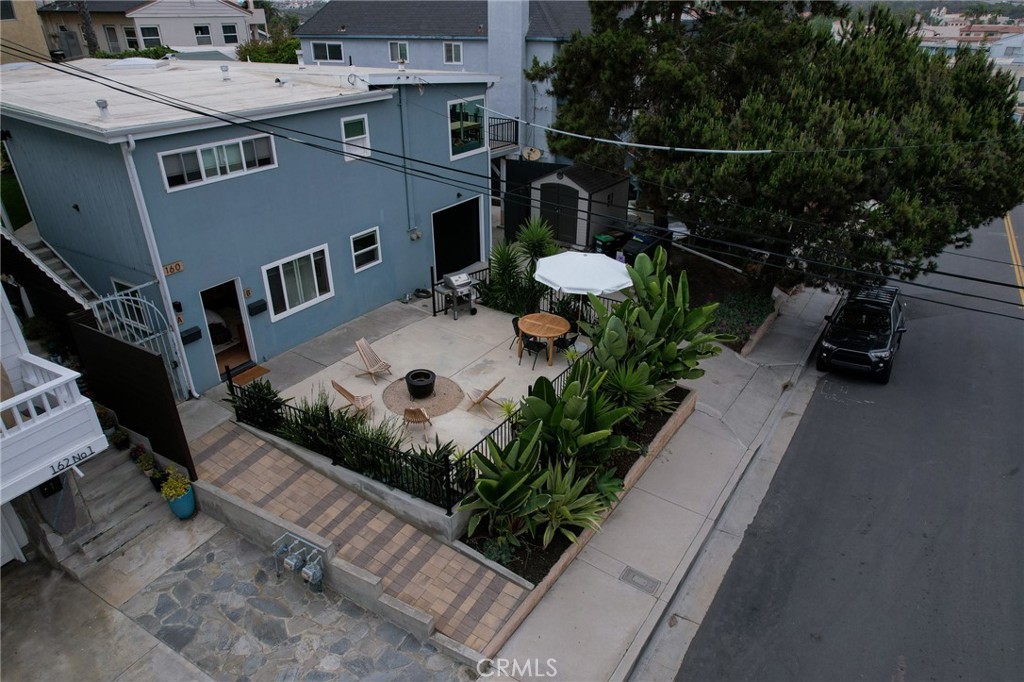 160 Avenida Florencia, Unit B San Clemente, CA 92672 - Photo 38 of 48 a view of a patio with table and chairs