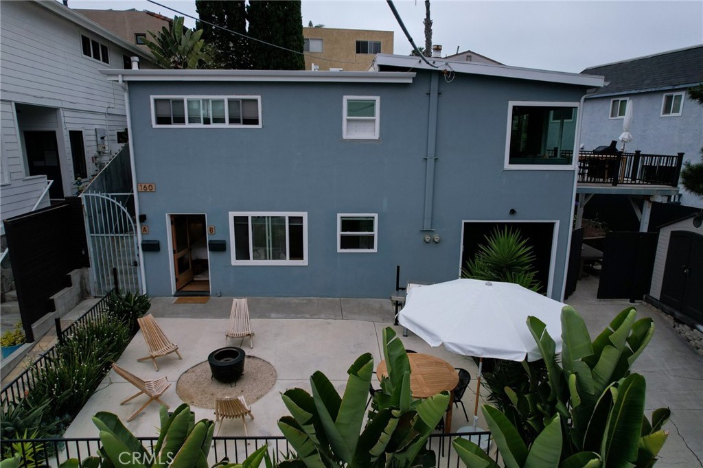 160 Avenida Florencia, Unit B San Clemente, CA 92672 - Photo 42 of 48 a backyard of a house with table and chairs