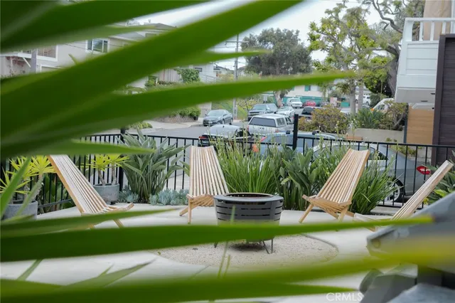 a view of a chair and tables in the balcony