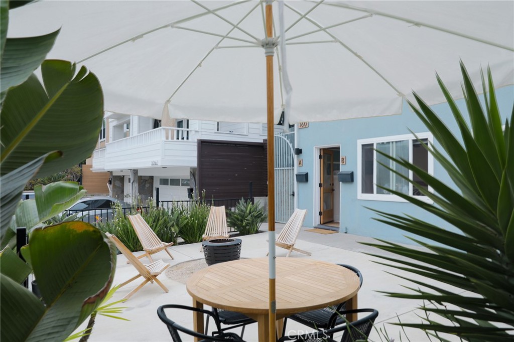160 Avenida Florencia, Unit B San Clemente, CA 92672 - Photo 8 of 48 a backyard of a house with table and chairs