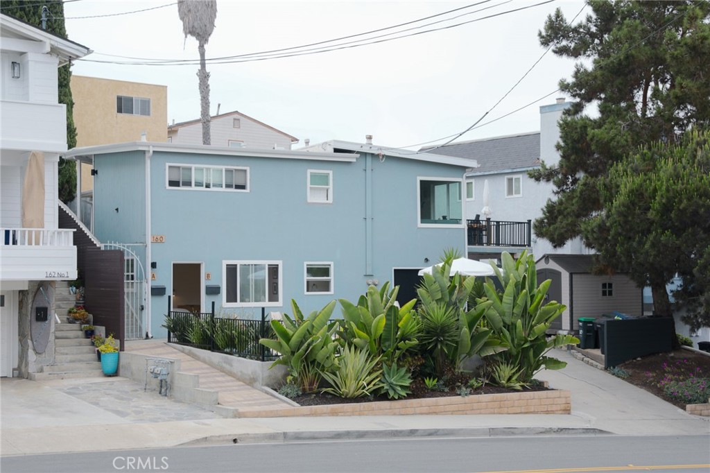 160 Avenida Florencia, Unit B San Clemente, CA 92672 - Photo 9 of 48 a front view of a house with a garden