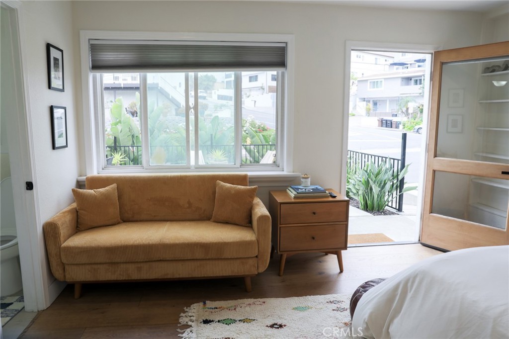 160 Avenida Florencia, Unit B San Clemente, CA 92672 - Photo 10 of 48 a living room with furniture and a large window