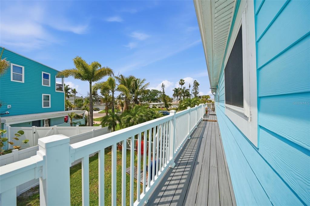 15823 Redington Drive Redington Beach, FL 33708 - Photo 16 of 39 a view of a balcony with wooden fence and floor