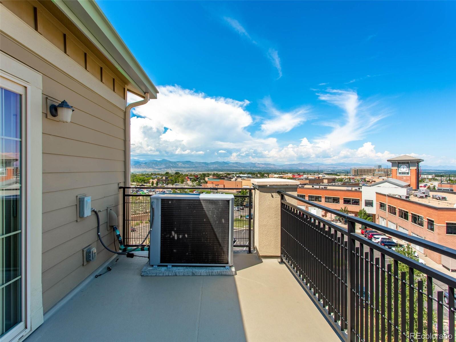 9258 Rockhurst Street, Unit 405 Highlands Ranch, CO 80129 - Photo 26 of 32 a view of a balcony with city and mountain view