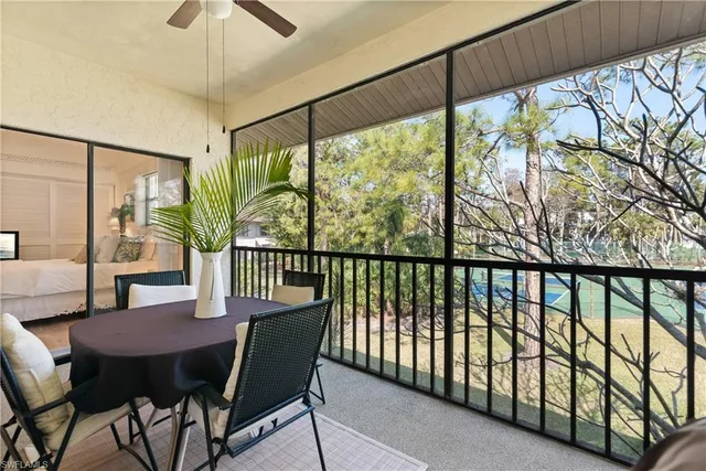 a view of a patio with swimming pool table and chairs