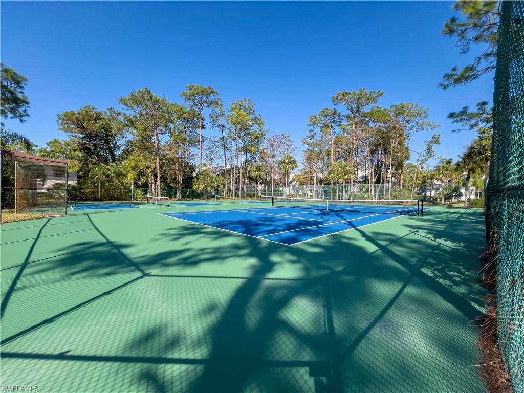 1833 Courtyard Way, Unit E204 Naples, FL 34112 - Photo 5 of 18 a view of a volley ball court