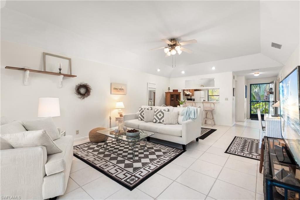 1833 Courtyard Way, Unit E204 Naples, FL 34112 - Photo 6 of 18 a living room with furniture