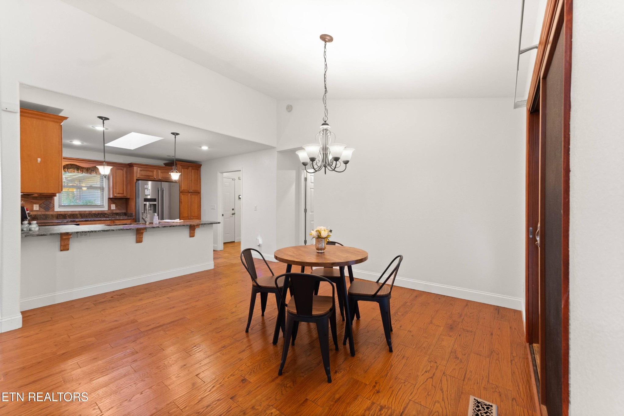 109 Markham Lane Crossville, TN 38558 - Photo 12 of 38 a view of a dining room with furniture and wooden floor