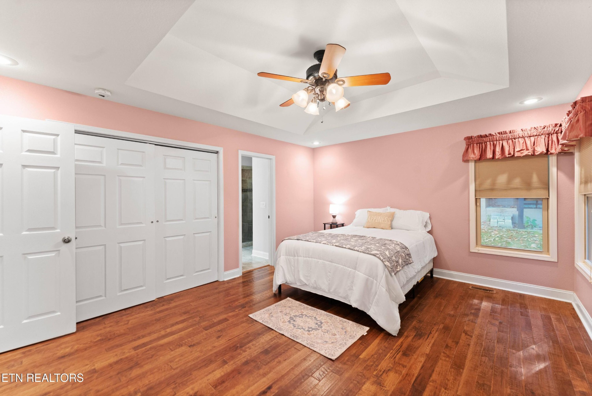 109 Markham Lane Crossville, TN 38558 - Photo 17 of 38 a bedroom with a large bed and a chandelier