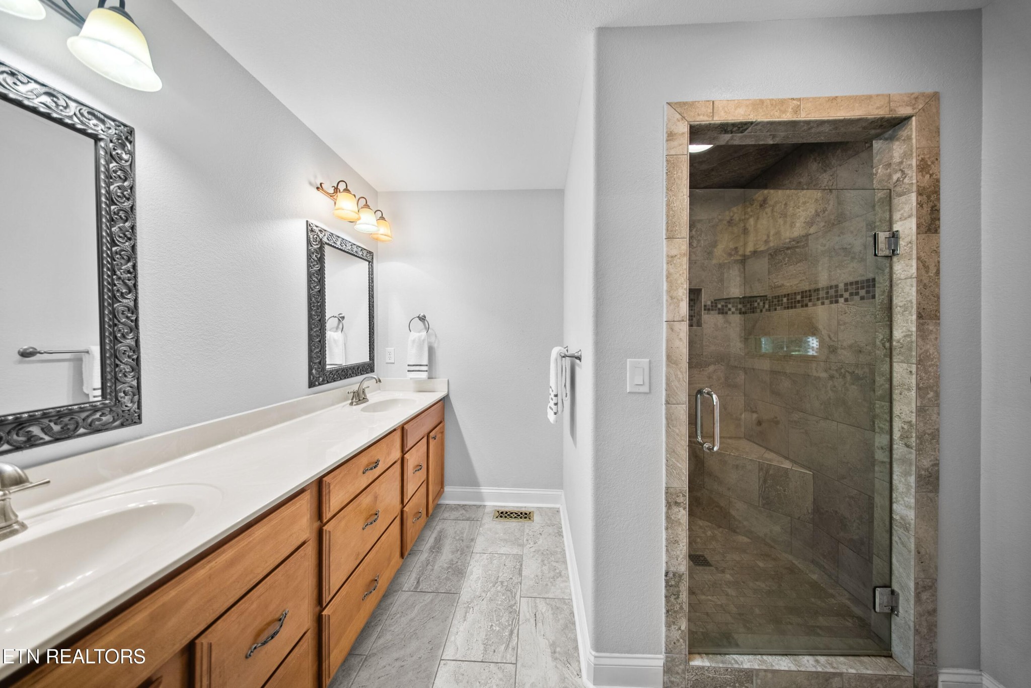 109 Markham Lane Crossville, TN 38558 - Photo 19 of 38 a bathroom with a double vanity sink and a mirror