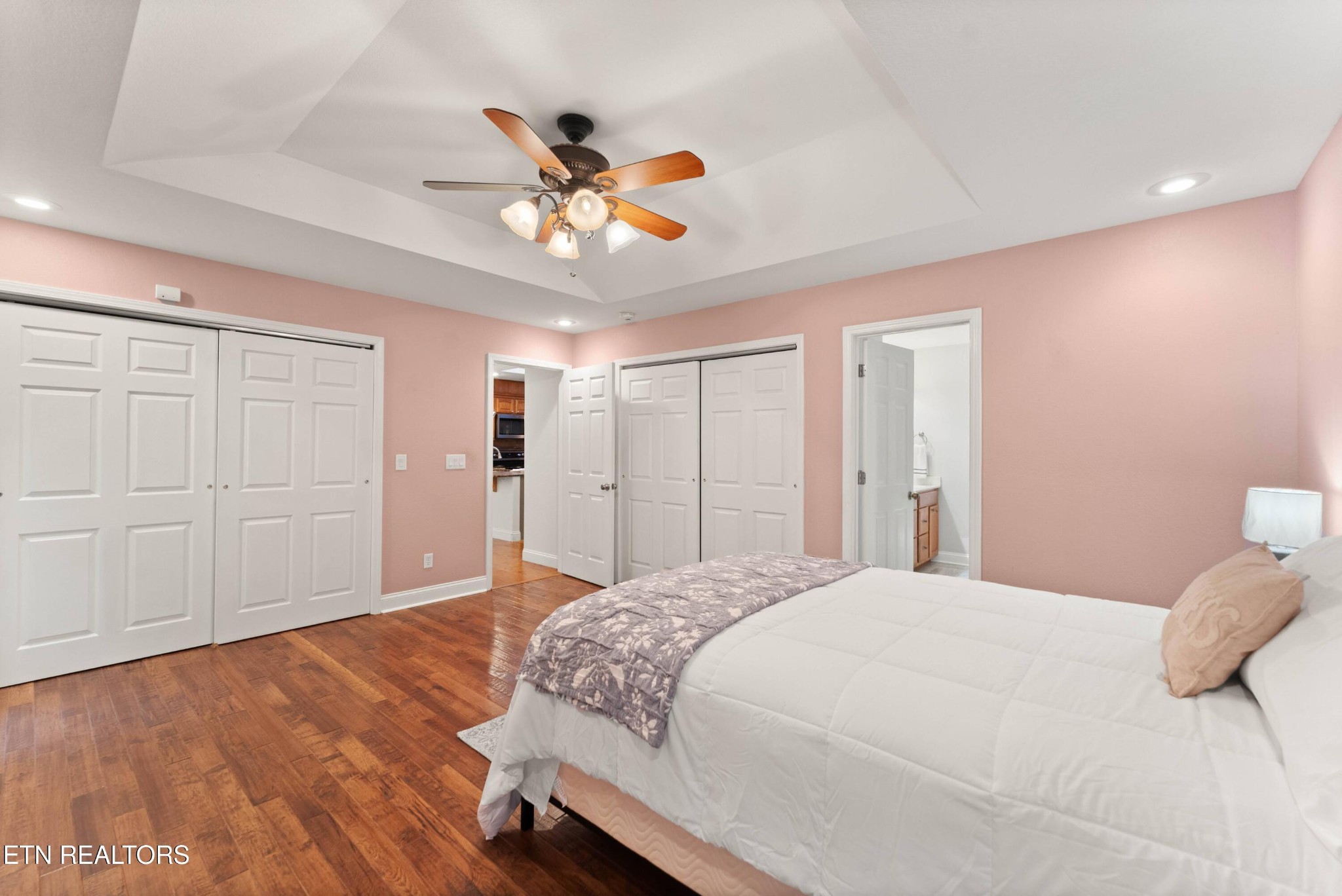 109 Markham Lane Crossville, TN 38558 - Photo 21 of 38 a bedroom with a large bed and wooden floor