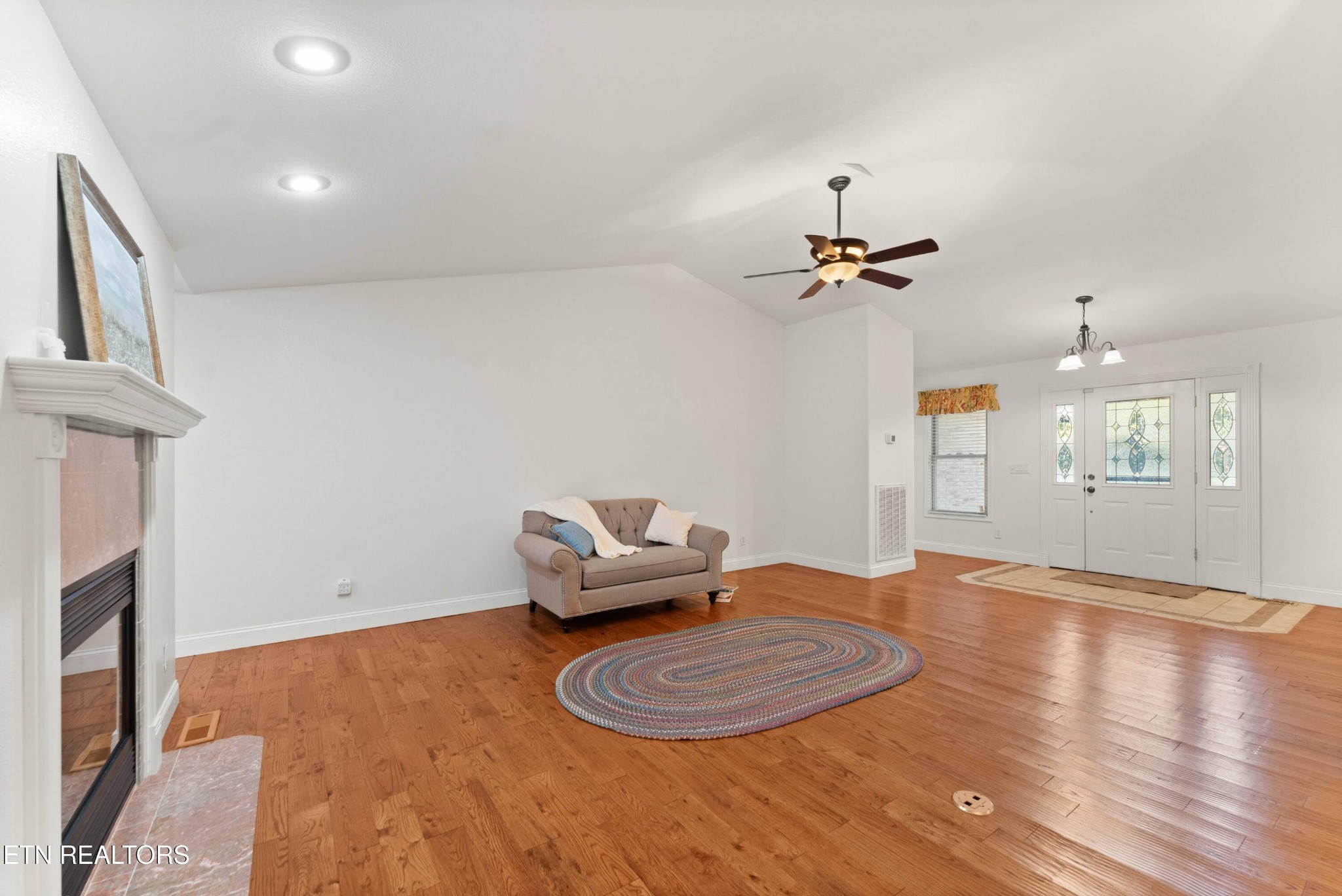 109 Markham Lane Crossville, TN 38558 - Photo 23 of 38 wooden floor in an empty room with a window