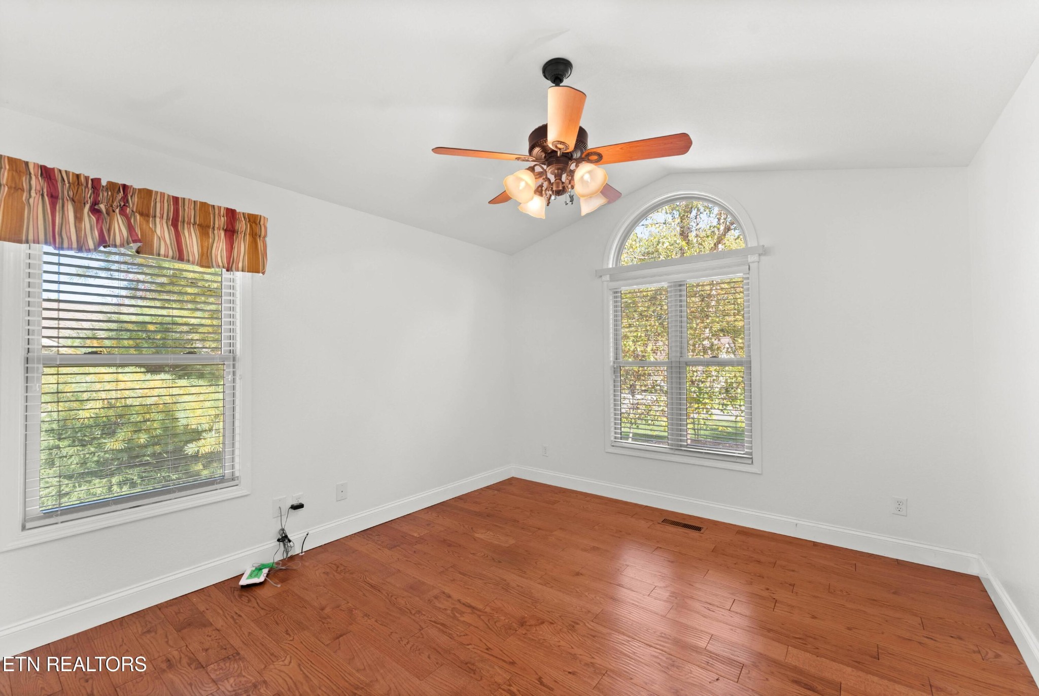 109 Markham Lane Crossville, TN 38558 - Photo 27 of 38 an empty room with windows and chandelier fan