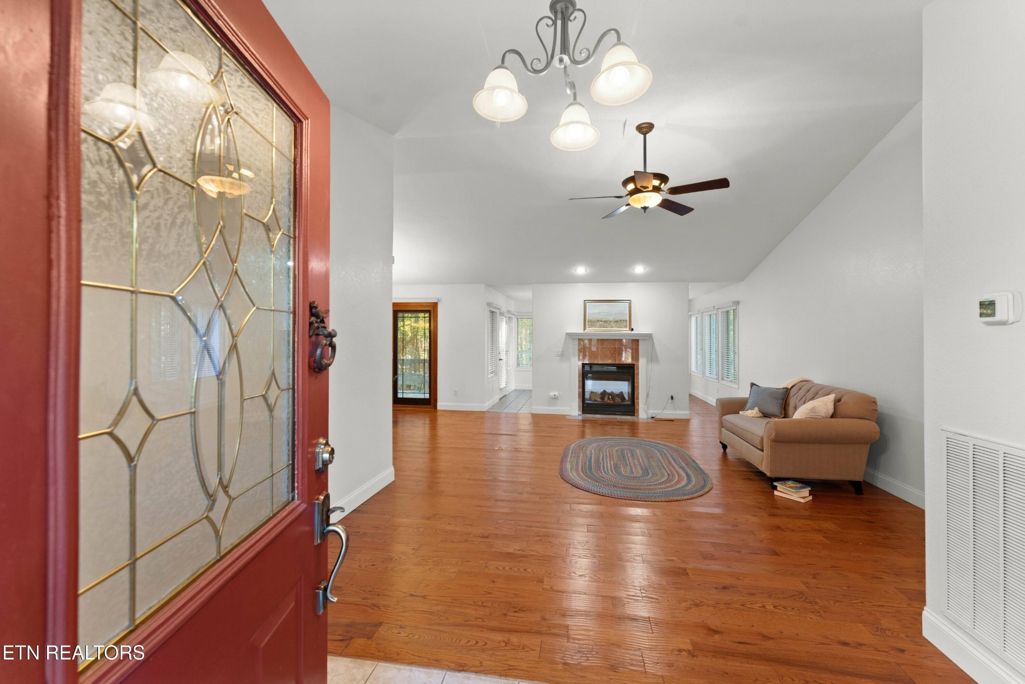 109 Markham Lane Crossville, TN 38558 - Photo 4 of 38 a view of a livingroom with furniture wooden floor and a ceiling fan