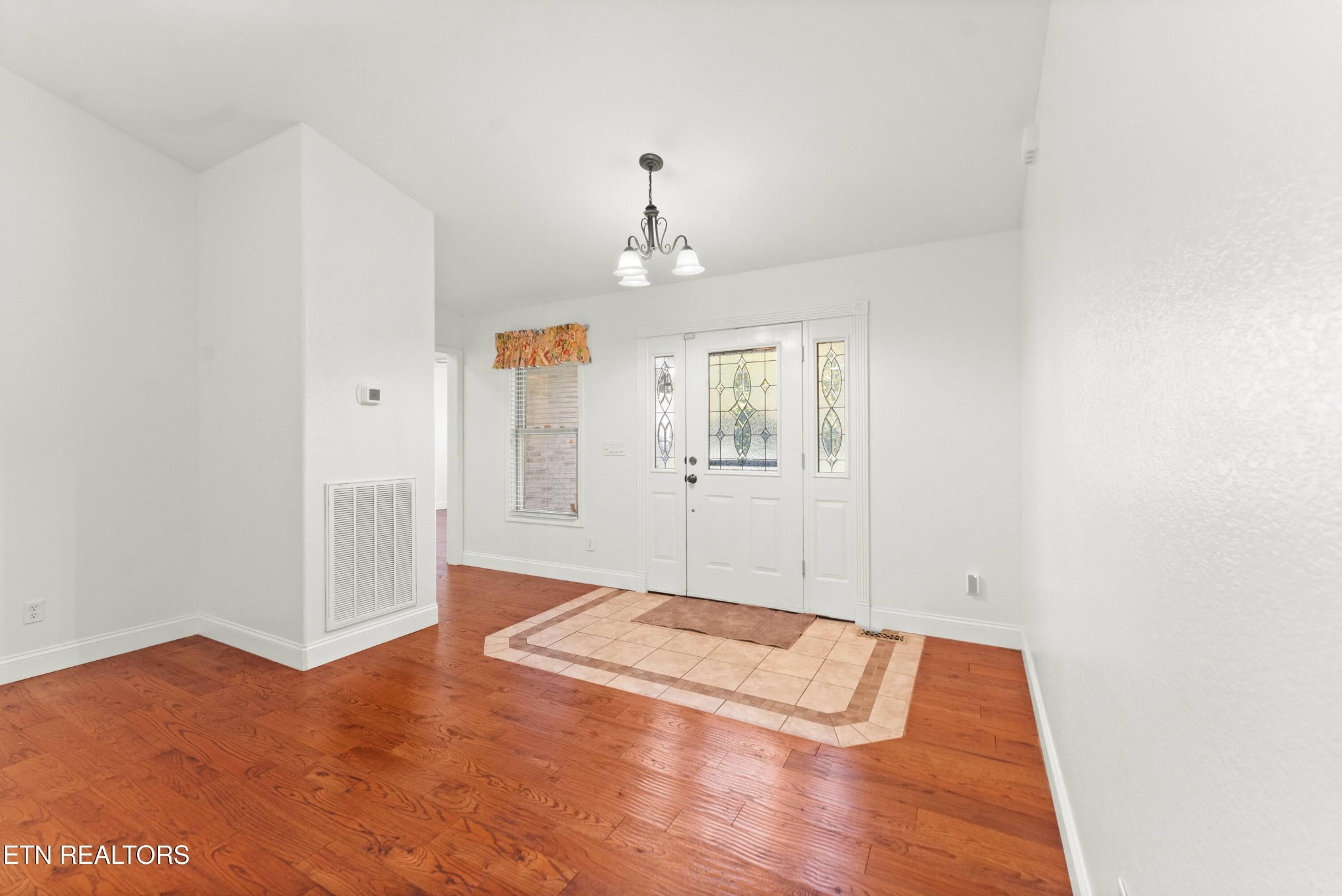 109 Markham Lane Crossville, TN 38558 - Photo 5 of 38 wooden floor in an empty room with a window