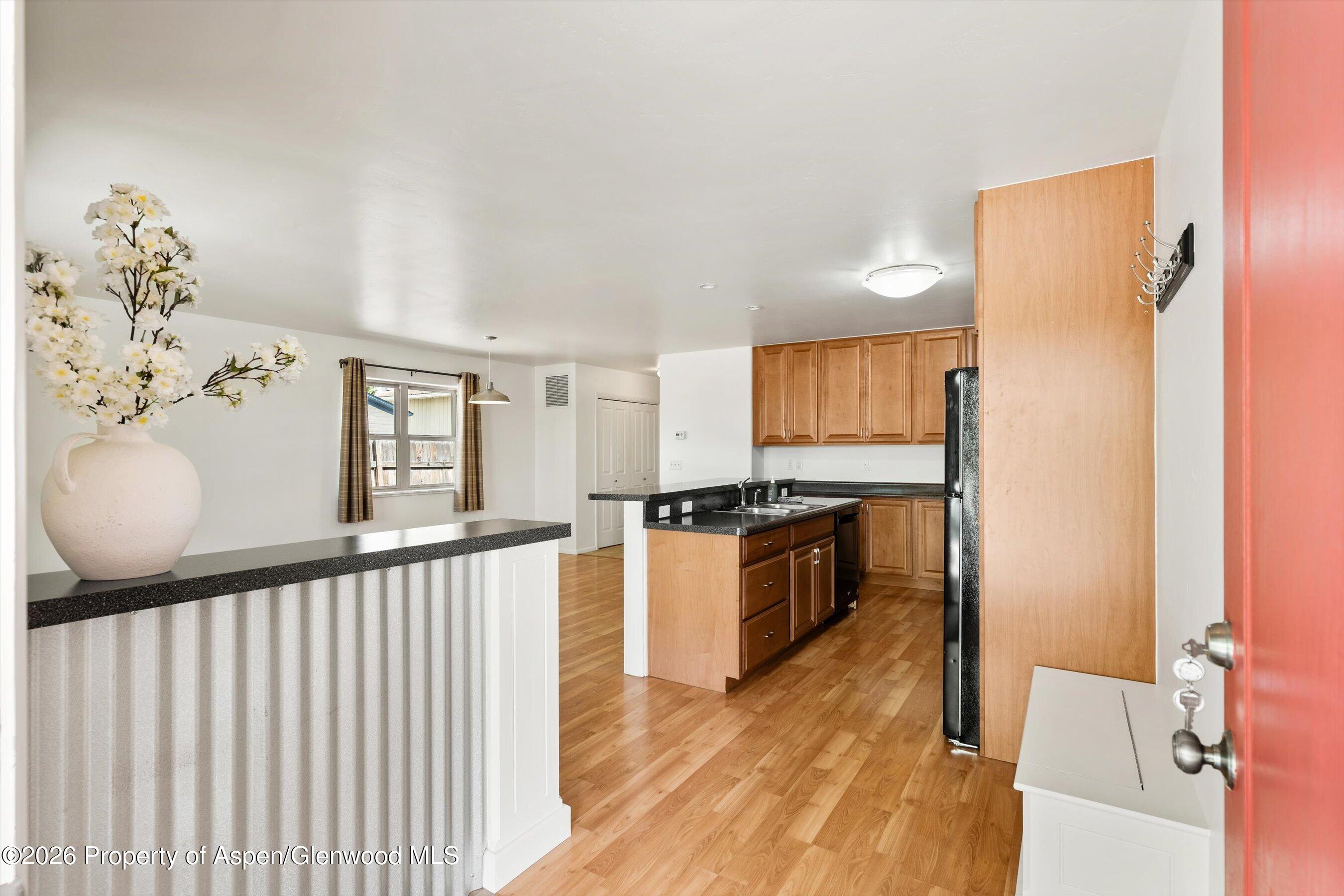 430-432 Whiteriver Avenue Rifle, CO 81650 - Photo 14 of 27 a large kitchen with a wooden floor